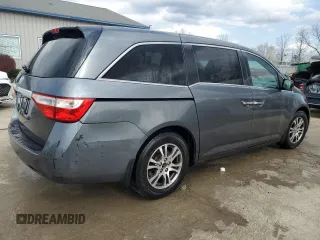 2013 Honda Odyssey EX z VIN 5FNRL5H40DB033400, wystawiony jako Copart lot #50552155 z przebiegiem 223 770 mil mil oraz Nie do naprawy. Historia ofert i sprzedaży dostępna na DreamBid. Obrazek 3.