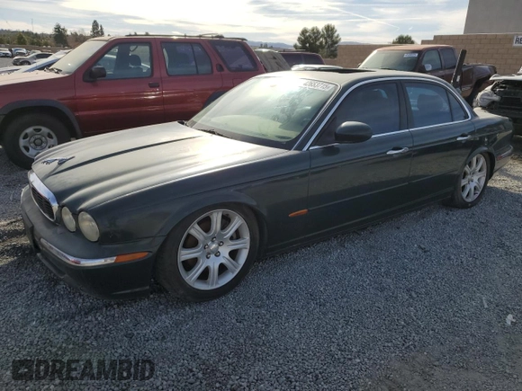 2004 Jaguar XJ with VIN SAJWA71C34SG29498, listed as a Copart auction lot 42653715 with 116,956 mi miles and Salvage Title. Bid and sale history available at carsss.com. Image 1.
