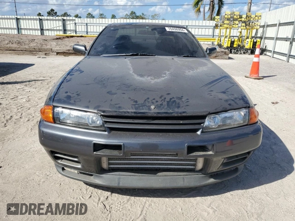 1990 Nissan Skyline z VIN BNR32010431, wystawiony jako Copart lot #78496994 z przebiegiem 182 401 mil mil oraz Nie do naprawy • Non repairable. Historia ofert i sprzedaży dostępna na DreamBid. Obrazek 5.