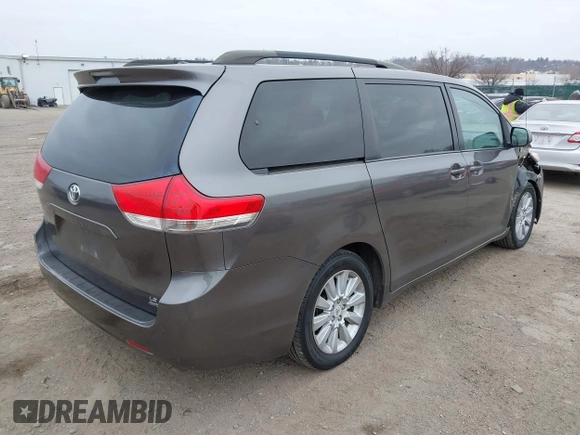 2012 Toyota Sienna LE with VIN 5TDJK3DCXCS047056, listed as a IAAI auction lot 41780756 with 179,624 mi miles. Bid and sale history available at carsss.com. Image 4.