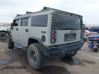 2003 Hummer H2 with VIN 5GRGN23U13H128617, listed as a IAAI auction lot 41494349 with 135,295 mi miles. Bid and sale history available at carsss.com. Image 3.