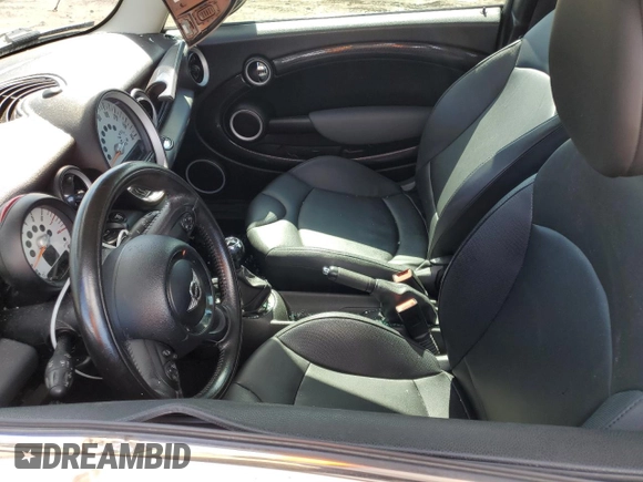 2011 MINI Hardtop S with VIN WMWSV3C59BTY23205, listed as a Copart auction lot 48672675 with 120,457 mi miles and Salvage Title. Bid and sale history available at DreamBid. Image 7.