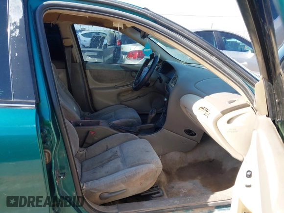 1999 Oldsmobile Alero GL z VIN 1G3NL52T0XC354966, wystawiony jako IAAI lot #42259258 z przebiegiem Nie podano mil oraz . Historia ofert i sprzedaży dostępna na DreamBid. Obrazek 5.