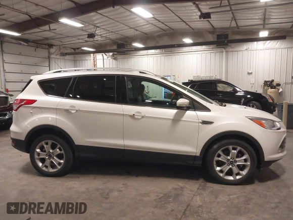 2016 Ford Escape Titanium with VIN 1FMCU9J99GUA61848, listed as a IAAI auction lot 42300324 with 51,692 mi miles and . Bid and sale history available at DreamBid. Image 13.