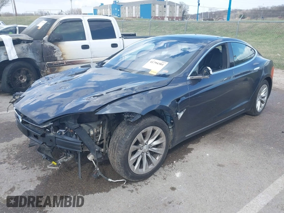 2016 Tesla Model S 70 with VIN 5YJSA1E14GF157118, listed as a IAAI auction lot 41794381 with 53,651 mi miles and . Bid and sale history available at DreamBid. Image 21.