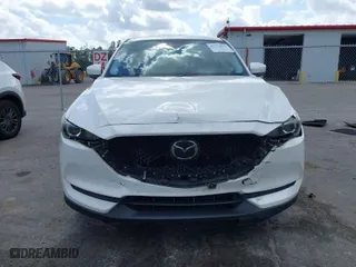 2020 Mazda CX-5 Touring with VIN JM3KFACM6L1820441, listed as a IAAI auction lot 41579634 with 55,416 mi miles. Bid and sale history available at carsss.com. Image 13.