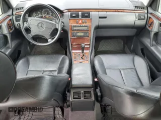 1999 Mercedes-Benz E-Class with VIN WDBJF65H0XA797390, listed as a Copart auction lot 55081405 with 80,950 mi miles and Salvage Title. Bid and sale history available at carsss.com. Image 8.
