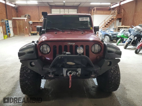 2007 Jeep Wrangler Sahara z VIN 1J4FA54127L132543, wystawiony jako Copart lot #55891995 z przebiegiem 74 616 mil mil oraz Szkoda całkowita • Salvage title. Historia ofert i sprzedaży dostępna na DreamBid. Obrazek 5.