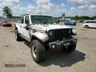2020 Jeep Gladiator Sport S z VIN 1C6JJTAG3LL215977, wystawiony jako Copart lot #55012635 z przebiegiem Nie podano mil oraz Szkoda całkowita • Salvage title. Historia ofert i sprzedaży dostępna na DreamBid. Obrazek 14.