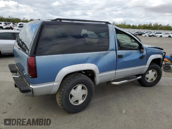 1995 GMC Yukon with VIN 1GKEK18K6SJ710419, listed as a Copart auction lot 80778474 with 215,789 mi miles and Salvage Title. Bid and sale history available at carsss.com. Image 3.