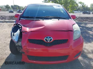 2009 Toyota Yaris with VIN JTDJT903695234623, listed as a IAAI auction lot 42027852 with 146,000 mi miles. Bid and sale history available at carsss.com. Image 12.