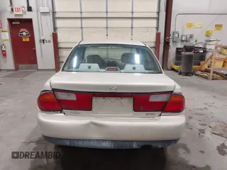 1998 Mazda Protege DX z VIN JM1BC1419W0171802, wystawiony jako IAAI lot #42202861 z przebiegiem 252 304 mil mil oraz . Historia ofert i sprzedaży dostępna na DreamBid. Obrazek 16.