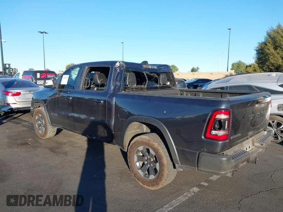 2019 Ram 1500 Rebel z VIN 1C6SRFLT2KN900600, wystawiony jako IAAI lot #41307832 z przebiegiem 74 481 mil mil oraz . Historia ofert i sprzedaży dostępna na DreamBid. Obrazek 6.