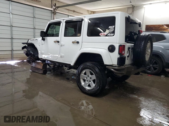 2017 Jeep Wrangler Unlimited Rubicon Recon with VIN 1C4HJWFG9HL543266, listed as a Copart auction lot 87771705 with 50,223 mi miles and Salvage title. Bid and sale history available at DreamBid. Image 2.