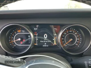 2023 Jeep Wrangler Sahara z VIN 1C4HJXEG7PW520699, wystawiony jako Copart lot #58273215 z przebiegiem 37 343 mil mil oraz Czysty tytuł • Clean title. Historia ofert i sprzedaży dostępna na DreamBid. Obrazek 9.