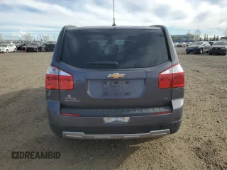 2012 Chevrolet Orlando 1LT z VIN KL77P2EM2CK508865, wystawiony jako Copart lot #76769314 z przebiegiem 100 074 mil mil oraz Szkody całkowita. Historia ofert i sprzedaży dostępna na DreamBid. Obrazek 6.