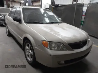2001 Mazda Protege LX with VIN JM1BJ226710470935, listed as a IAAI auction lot 41577385 with 235,128 mi miles and . Bid and sale history available at carsss.com. Image 1.