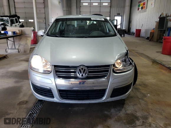 2009 Volkswagen Jetta z VIN 3VWAL71KX9M072304, wystawiony jako Copart lot #57027785 z przebiegiem 191 554 mil mil oraz Szkoda całkowita • Salvage title. Historia ofert i sprzedaży dostępna na DreamBid. Obrazek 5.