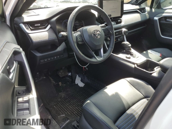 2023 Toyota RAV4 Hybrid XSE with VIN 2T3E6RFVXPW040152, listed as a Copart auction lot 61645565 with 26,408 mi miles and Salvage title. Bid and sale history available at DreamBid. Image 8.