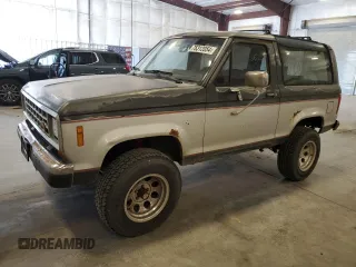 1988 Ford Bronco z VIN 1FMCU14T4JUA54161, wystawiony jako Copart lot #76312054 z przebiegiem 34 932 mil mil oraz Szkoda całkowita • Salvage title. Historia ofert i sprzedaży dostępna na DreamBid. Obrazek 1.