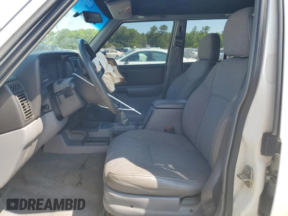 1998 Jeep Cherokee Sport with VIN 1J4FJ68S8WL116368, listed as a Copart auction lot 59228735 with 113,546 mi miles and Salvage title. Bid and sale history available at DreamBid. Image 7.