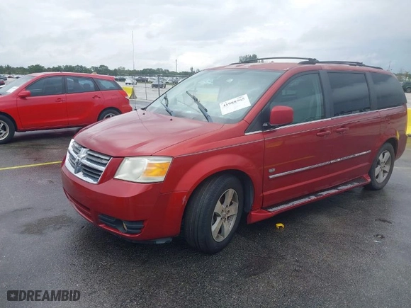 2009 Dodge Grand Caravan SXT with VIN 2D8HN54X49R641293, listed as a IAAI auction lot 41988765 with 106,734 mi miles. Bid and sale history available at carsss.com. Image 2.