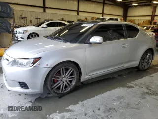 2011 Scion tC with VIN JTKJF5C79B3012280, listed as a Copart auction lot 47857355 with 134,572 mi miles and Salvage Title. Bid and sale history available at carsss.com. Image 1.