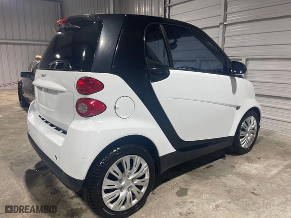 2012 Smart fortwo Pure with VIN WMEEJ3BA5CK540092, listed as a Copart auction lot 51878135 with 59,356 mi miles and Salvage Title. Bid and sale history available at carsss.com. Image 4.