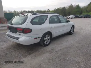 2003 Ford Taurus SE z VIN 1FAFP58S63A158422, wystawiony jako IAAI lot #41933813 z przebiegiem 71 990 mil mil oraz . Historia ofert i sprzedaży dostępna na DreamBid. Obrazek 4.