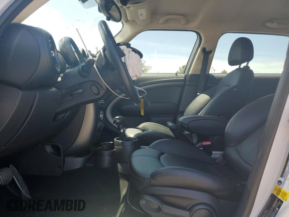 2016 MINI Countryman S with VIN WMWZC5C51GWU00690, listed as a Copart auction lot 55077095 with 104,176 mi miles and Salvage title. Bid and sale history available at DreamBid. Image 7.