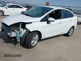 2017 Ford Fiesta SE z VIN 3FADP4BJ1HM126375, wystawiony jako IAAI lot #42244318 z przebiegiem 70 829 mil mil oraz . Historia ofert i sprzedaży dostępna na DreamBid. Obrazek 2.