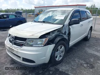 2013 Dodge Journey Canada Value z VIN 3C4PDCAB1DT646810, wystawiony jako IAAI lot #42484918 z przebiegiem 212 456 mil mil oraz . Historia ofert i sprzedaży dostępna na DreamBid. Obrazek 2.