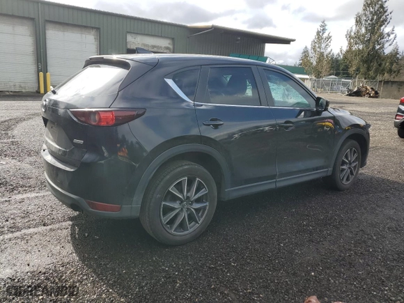 2018 Mazda CX-5 Touring with VIN JM3KFBCM0J0370942, listed as a Copart auction lot 47953165 with 130,867 mi miles and Salvage Title. Bid and sale history available at carsss.com. Image 3.