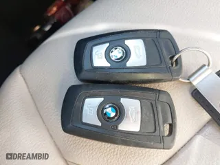 2015 BMW 2 Series 228i with VIN WBA1K5C50FV474011, listed as a IAAI auction lot 41805879 with 83,489 mi miles. Bid and sale history available at carsss.com. Image 10.