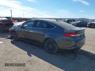 2017 Ford Fusion Hybrid Titanium z VIN 3FA6P0RU0HR314681, wystawiony jako IAAI lot #41288256 z przebiegiem 174 027 mil mil oraz . Historia ofert i sprzedaży dostępna na DreamBid. Obrazek 3.
