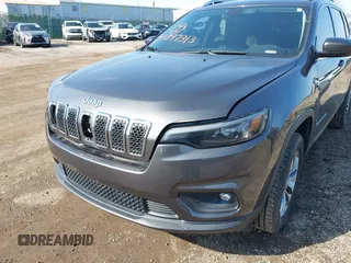 2019 Jeep Cherokee Latitude Plus with VIN 1C4PJMLBXKD162570, listed as a IAAI auction lot 41897313 with 142,110 mi miles. Bid and sale history available at carsss.com. Image 6.