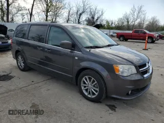 2014 Dodge Grand Caravan SXT 30th Anniversary with VIN 2C4RDGCG4ER285294, listed as a Copart auction lot 52109205 with 196,331 mi miles and Salvage Title. Bid and sale history available at DreamBid. Image 4.