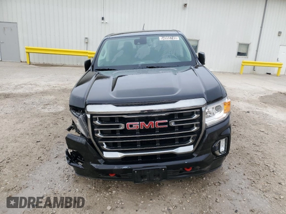 2021 GMC Canyon 4WD AT4 z VIN 1GTG6FEN9M1192443, wystawiony jako Copart lot #54955745 z przebiegiem 1544 mil mil oraz Tytuł czysty. Historia ofert i sprzedaży dostępna na DreamBid. Obrazek 5.