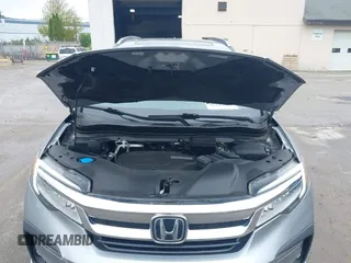 2020 Honda Pilot Touring 8-Passenger z VIN 5FNYF6H91LB042626, wystawiony jako IAAI lot #42249440 z przebiegiem 57 429 mil mil oraz . Historia ofert i sprzedaży dostępna na DreamBid. Obrazek 10.
