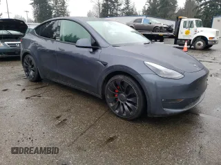 2022 Tesla Model Y Performance with VIN 7SAYGDEF2NF459268, listed as a Copart auction lot 45764735 with 64,421 mi miles and Salvage title. Bid and sale history available at DreamBid. Image 4.