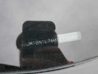 2017 Mazda 3 Touring z VIN JM1BN1L76H1111649, wystawiony jako Copart lot #51713185 z przebiegiem 104 749 mil mil oraz Szkoda całkowita • Salvage title. Historia ofert i sprzedaży dostępna na DreamBid. Obrazek 12.