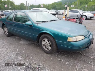 1996 Ford Thunderbird LX z VIN 1FALP62W9TH118637, wystawiony jako IAAI lot #42311641 z przebiegiem 96 361 mil mil oraz . Historia ofert i sprzedaży dostępna na DreamBid. Obrazek 1.