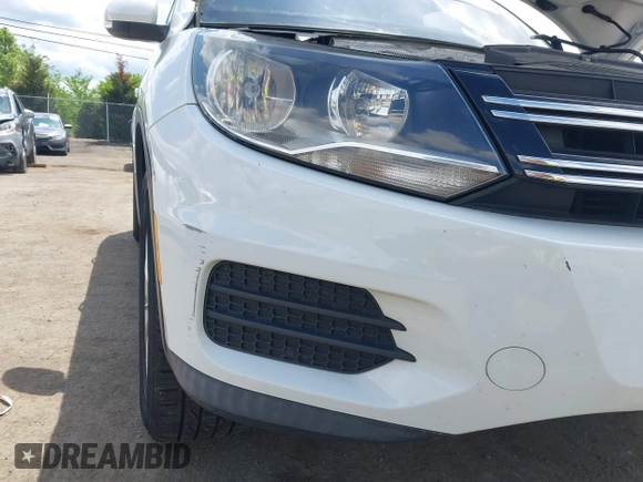 2014 Volkswagen Tiguan S with VIN WVGBV3AX0EW589381, listed as a IAAI auction lot 42186999 with 144,137 mi miles and . Bid and sale history available at DreamBid. Image 6.