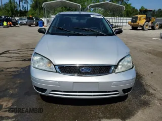 2007 Ford Focus S z VIN 1FAFP34N97W264411, wystawiony jako Copart lot #53251655 z przebiegiem 159 516 mil mil oraz Szkody całkowita. Historia ofert i sprzedaży dostępna na DreamBid. Obrazek 5.