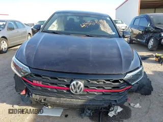 2019 Volkswagen Jetta GLI S z VIN 3VW5T7BU3KM245927, wystawiony jako IAAI lot #41573257 z przebiegiem 57 322 mil mil oraz . Historia ofert i sprzedaży dostępna na DreamBid. Obrazek 13.