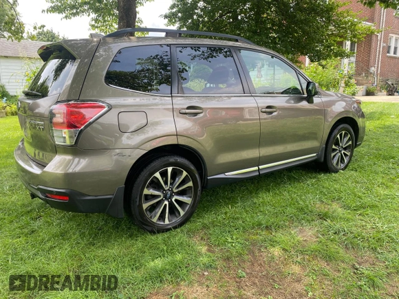 2017 Subaru Forester Touring с VIN JF2SJGWC9HH402713, выставлен на аукционе Copart как лот 63635365 с пробегом 128 906 миль миль и Чистый • Clean title. История ставок и продаж доступна на DreamBid. Изображение 4.