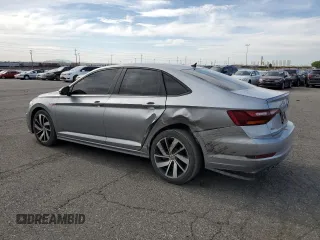 2019 Volkswagen Jetta GLI S z VIN 3VW6T7BU1KM244828, wystawiony jako Copart lot #56495205 z przebiegiem 112 512 mil mil oraz Szkody całkowita. Historia ofert i sprzedaży dostępna na DreamBid. Obrazek 2.