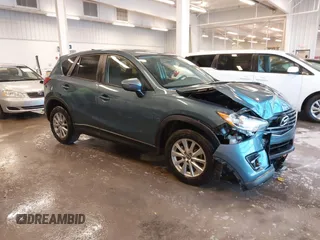 2016 Mazda CX-5 Touring z VIN JM3KE2CY3G0901436, wystawiony jako IAAI lot #41362043 z przebiegiem 81 143 mil mil oraz . Historia ofert i sprzedaży dostępna na DreamBid. Obrazek 1.