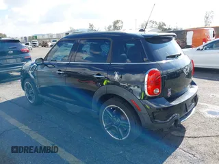2014 MINI Countryman S with VIN WMWZC3C56EWP27880, listed as a IAAI auction lot 38577048 with 96,812 mi miles and . Bid and sale history available at DreamBid. Image 3.