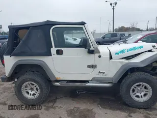 2005 Jeep Wrangler Sport with VIN 1J4FA49S25P320240, listed as a IAAI auction lot 41433371 with 144,552 mi miles. Bid and sale history available at carsss.com. Image 13.